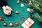 Christmas decorations hand amid Christmas trees and gifts