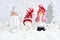 Christmas decorations little figure boy and girl and snowmen with festive decorations Ð¾n the snow. Christmas or New Year greeting