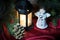 Christmas decorations with little toy angel, bright light glowing lantern
