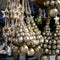 Christmas Decorations made of Golden round Bells and Golden wooden Stars hanging on market for sale