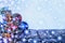 Christmas decorations, multi-colored balls and gifts with a Christmas tree on a wooden background with a copy of the free space. N