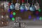 Christmas decorations in silver and blue hanging from a bar