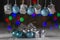 Christmas decorations in silver and blue hanging from a bar