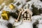 Christmas decorations on a snow-covered fir tree, decorative house and key to the lock, concept