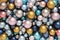 Christmas decorations, top view of pile of glass colored balls, useful as a greeting gift card background