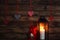 Christmas decorations with toy Santa Claus and candle in dark interior. Cristmas concept. New Year concept.