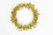 Christmas decorations of yellow and golden color on white background - round circle of tinsel. New year concept