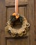 Christmas decorative wreath made from orange hanging on the door