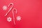 Christmas decors snowflakes and candy cane on red background