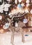 Christmas deer and Christmas tree background with decorations, snow, blurred, sparking, glowing. Happy New Year and Xmas theme