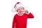 Christmas dentistry. Happy blonde kid boy in red santa costume and hat brushing teeth on white background. Health care