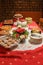 Christmas desert table with red cloth.