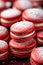 Christmas dessert idea, delicious red macarons on a platter, sweet xmas celebration gift