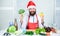 Christmas diet. Healthy christmas holiday recipes. How make your christmas dinner healthier. Man bearded chef wear santa