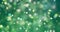 Christmas digital glitter sparks green yellow color particles bokeh flowing on green background, holiday xmas festive happy new