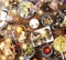 Christmas dinner. Falling golden snowflakes. Cheers Top of view of a nicely served wooden table Christmas dinner with tasty dishes