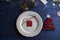 Christmas Dinner rustic, white plate, and napkin red boxes in th