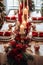 Christmas dinner table decorated with gold and red decorations by Generative AI