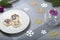 Christmas dinner table decorations with beautiful edible flower cookies and scented candle