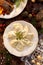 Christmas dumplings with cabbage and mushroom filling on a white plate.