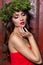 Christmas elegant fashion woman. Xmas New Year hairstyle and makeup. Gorgeous Vogue style Lady with Christmas decorations on her