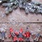 Christmas elfs and branches fur tree on aged wooden background