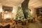 Christmas evening in the light of candles and garlands. Classic luxurious apartments with decorated christmas tree and