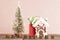 Christmas evergreen tree with lights, gingerbread house, word christmas and gifts