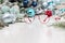 Christmas eyeglasses red spectacles with ribbon bow isolated on white table with balls and decorations useful as a greeting gift