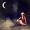 Christmas fairy woman in red dress and santa hat