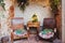 Christmas family garden or front porch. Rustic boho outdoor decor and old wooden table and armchairs