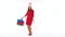 Christmas female shopper holding multicolored shopping bags on white background in studio. Let`s go holiday shopping