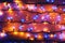 Christmas, festive background with glowing garland. Colorful lights on a dark background. New Year cards, postcard, banner.