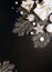 Christmas festive dark background. White gifts, Christmas decor with sparkles on black background Flat Lay Copy Space