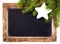 Christmas Fir branch on Vintage Christmas Blackboard frame isol