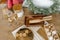 Christmas flat lay. Ginger cookies and molds on a wooden board, champagne glasses, rolling pins, a fir wreath