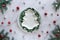 Christmas flat lay on marble table, copy-space on ceramic plate. Xmas background in green, white and red. Natural fir twigs, holly