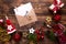 Christmas flat lay on a wooden background with keys to new house in the center with a envelope with a note sheet. New year, transf