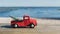 Christmas in Florida theme, red toy truck hauls a christmas tat Lake Louisa State Park in Clermont, Florida