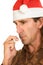 Christmas flu - middle aged man using nasal spray