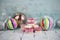 Christmas food photography picture with old fashioned English coconut ice sweets and bauble tree decorations in the background