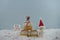 Christmas food photography using marshmallows shaped as snowman and standing in snow with cream sponge fairy cake