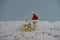 Christmas food photography using marshmallows shaped as snowman and standing in snow with cream sponge fairy cake