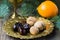 Christmas food still life: arabic dates, walnuts, persimmon