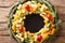 Christmas food: a wreath of pesto cheese, cheddar, mimolette wit