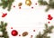 Christmas frame and background. Happy New Year composition. Christmas balls, red berries, pine cones, fir branches on wooden white