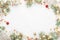 Christmas frame of spruce, red & gold christmas decorations on w