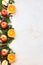 Christmas fresh fruit  background border with oranges,  apples and spices