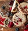 Christmas fruit mince pies with cherries, pomegranate seeds, raisins and blueberries. With Christmas star decoration