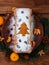 Christmas fruitcake powdered sugar tangerine fir tree festive decoration wooden background flat lay. Stollen cake loaf